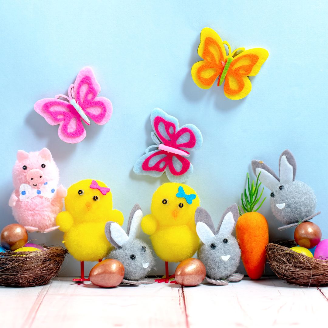 A group of Easter toys, including plastic eggs, chickens and butterflies
